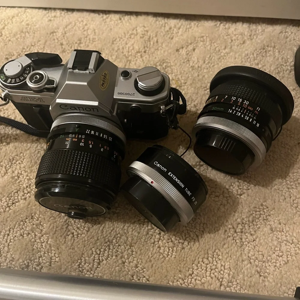 Canon camera, two 50mm lenses and tripod all included. it’s been well stored